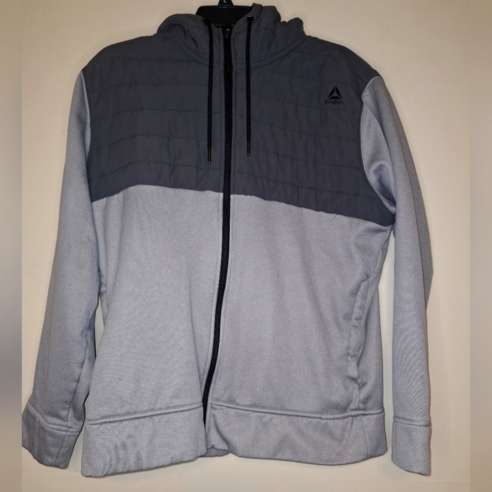 A Reebok hooded full zip lightweight jacket in a mens size large.